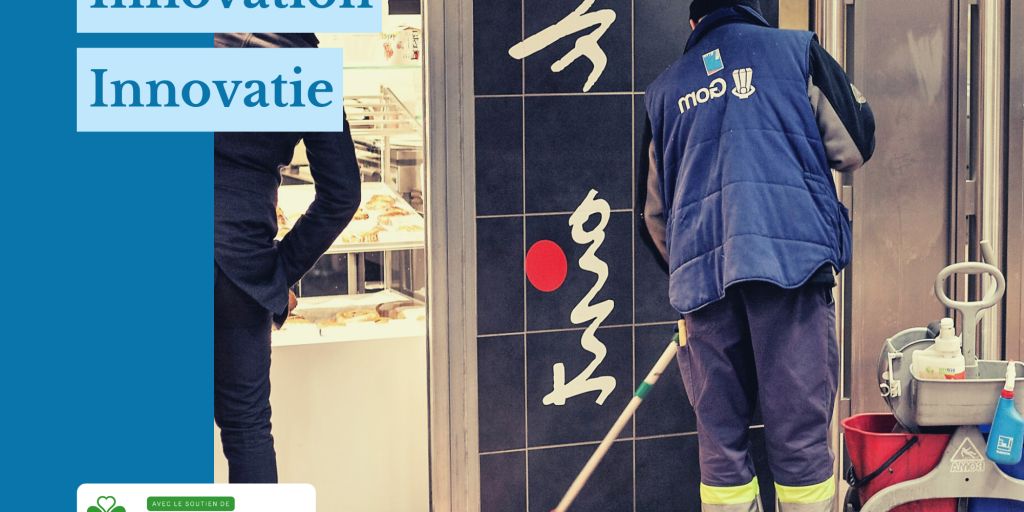 Schoonmaker in actie in een metrostation, tegenover een muur, naast een bakkerijgedeelte